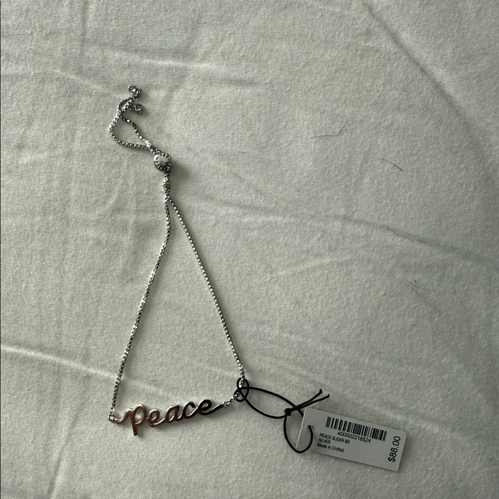 Henri Bendel Silver and Gold 'Peace' Bracelet